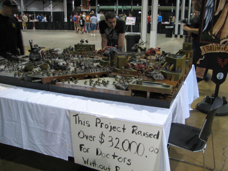 Display of orks fighting space marines at Games Day