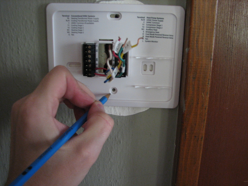 Marking holes for new thermostat